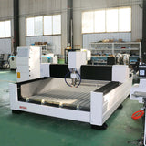 High-precision heavy-duty stone CNC router for cutting, carving, and engraving on stone, metal, jade, and wood in a workshop setting.