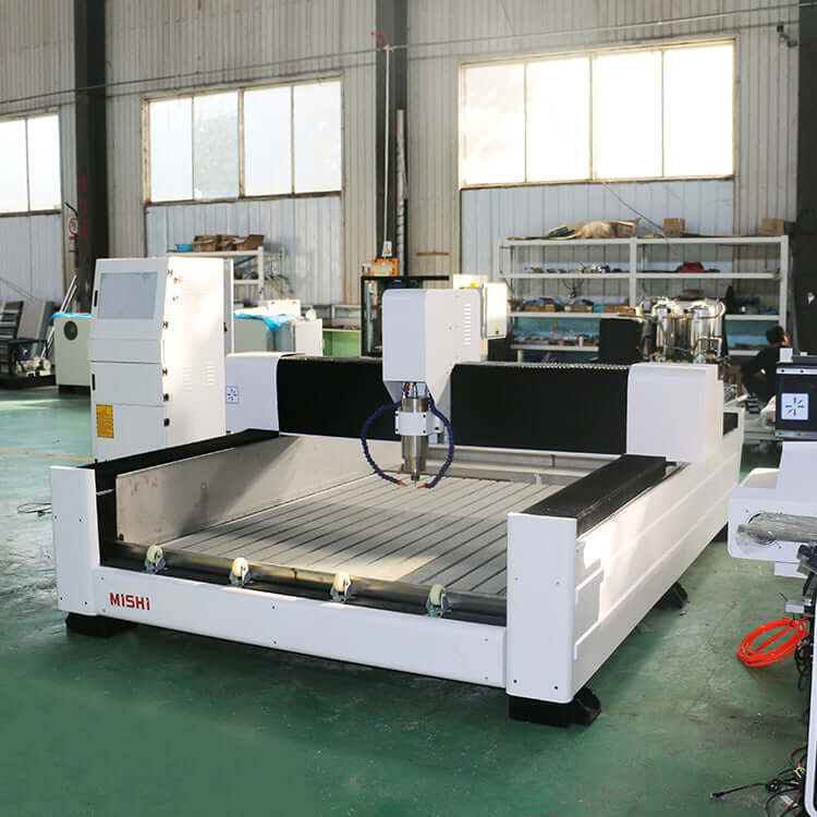 High-precision heavy-duty stone CNC router for cutting, carving, and engraving on stone, metal, jade, and wood in a workshop setting.