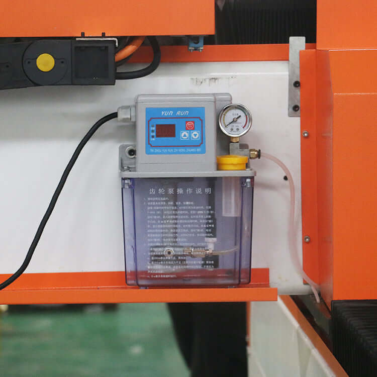 Close-up of lubrication system on high-precision CNC router for foam and 3D engraving, featuring pressure gauge and control panel.