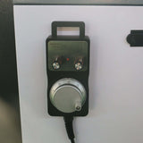 Close-up of CNC router rotary hand control for precision adjustments on a customized small size 4-axis ATC CNC router machine.