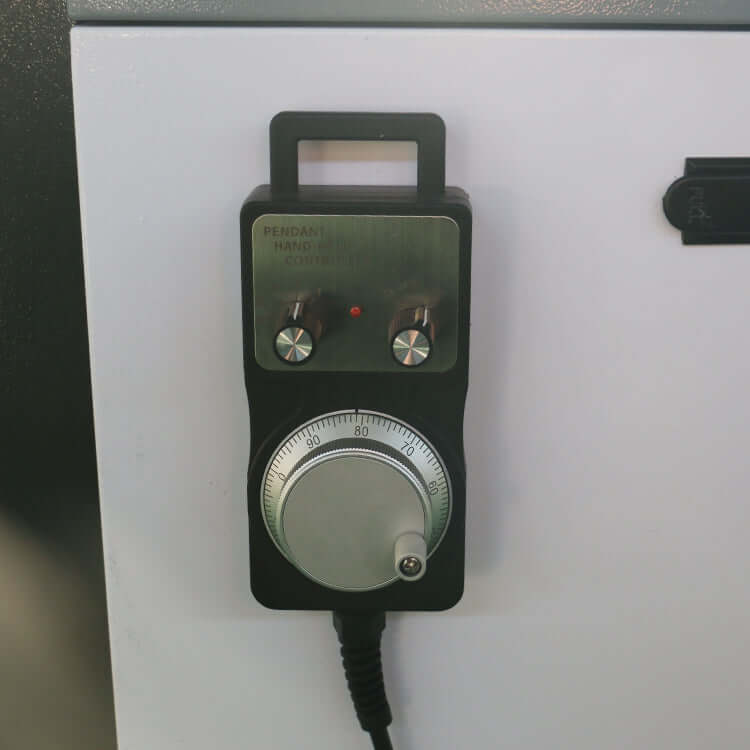 Close-up of CNC router rotary hand control for precision adjustments on a customized small size 4-axis ATC CNC router machine.