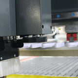 Close-up of ATC CNC Router with CCD Camera and Pressure Roller in operation, ideal for furniture industry cutting and engraving.