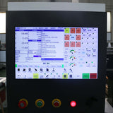 Close-up of 4 Axis ATC CNC Router control panel with display screen and operating controls for precision woodworking tasks.