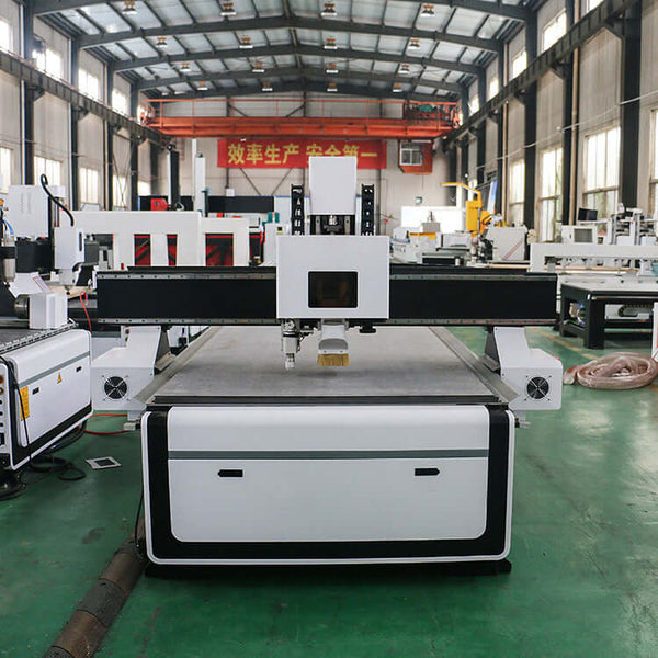 CNC router with oscillating knife in warehouse for cutting wood, fabric, and rubber efficiently.