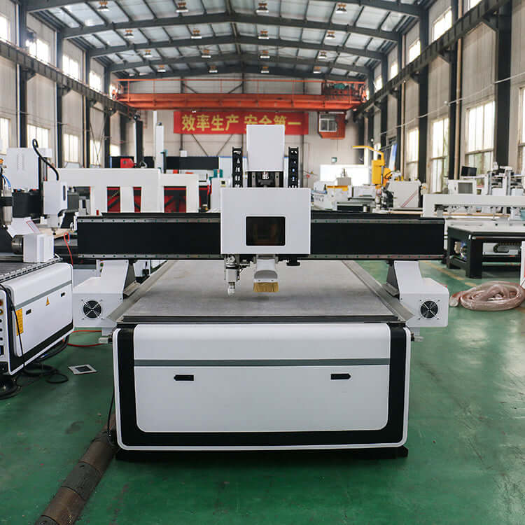 CNC router with oscillating knife in warehouse for cutting wood, fabric, and rubber efficiently.