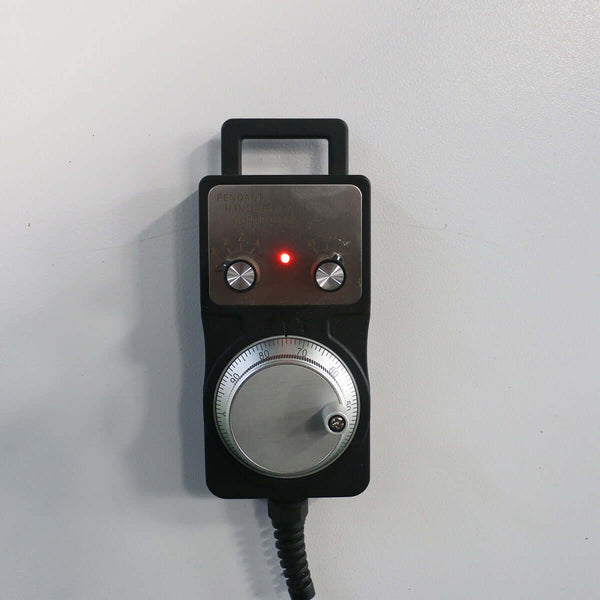 Handheld CNC controller with two dials and LED indicator, used for precision adjustments in CNC machinery operations.