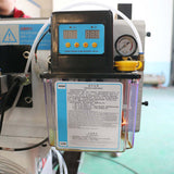 CNC router machine component for precision tool operation with digital display and pressure gauge.