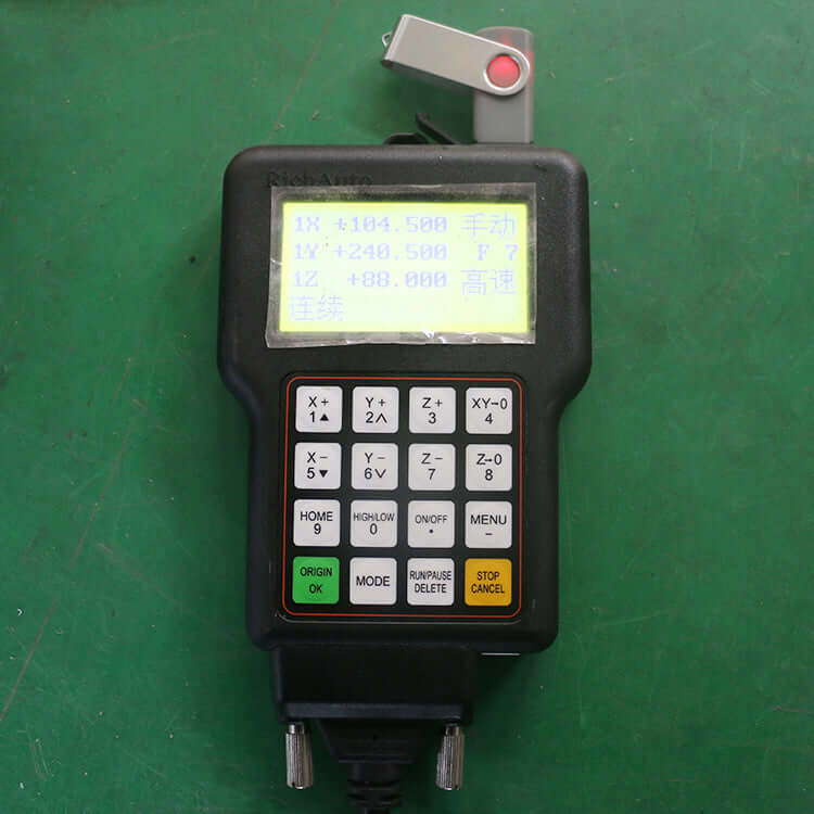 Handheld controller for mini CNC router, featuring display and function buttons for precise milling and engraving operations on metals.