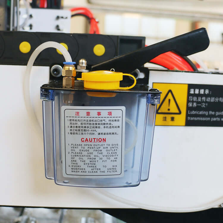 Lubrication system on a 4-Axis Mini CNC Router for 3D wood carving, featuring clear fluid container for maintenance.