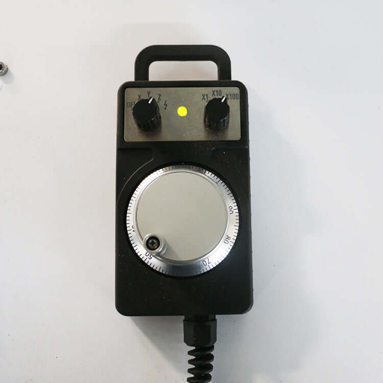 Handheld CNC router remote control with dial and buttons for precision adjustments.