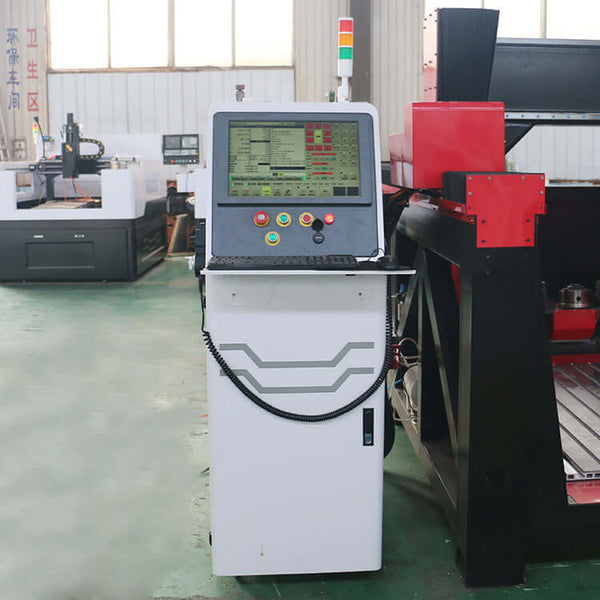 Control panel of a customized 5 Axis CNC router in a workshop setting.