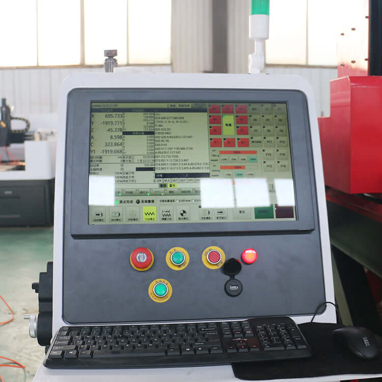 Control panel of a customized 5 axis CNC router machine with screen and keyboard in an industrial setting.