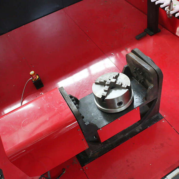 Close-up of red customized 5-axis CNC router machine part on workshop floor