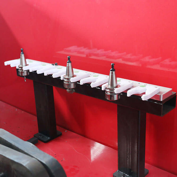 Customized 5 Axis CNC Router with tool holders inside a red machine enclosure for precision manufacturing.