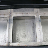 Interior view of a customized metal CNC router base showing structural components and machine finish.