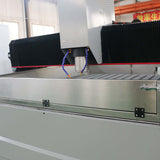 Customized metal CNC router in industrial setting with precision cutting features.