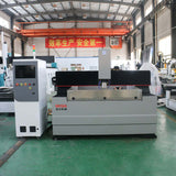 High-tech CNC metal router machine in an industrial factory setting.