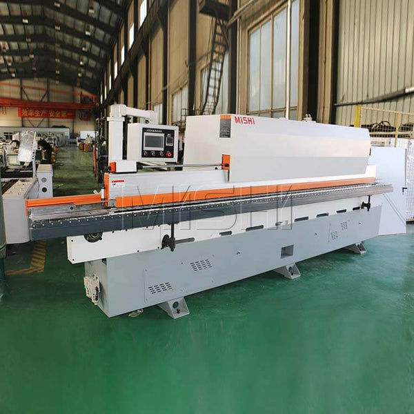 Precision automatic edge banding machine for furniture in a factory setting, showcasing advanced design and high-quality build.
