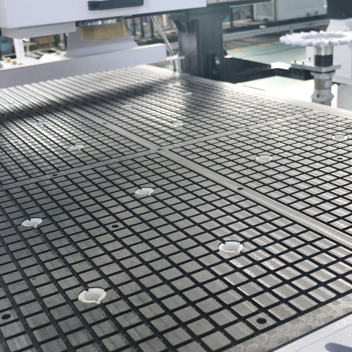 Close-up of efficient auto-loading ATC CNC router with automatic feeding system for high-efficiency furniture production.