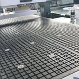 Close-up of efficient auto-loading ATC CNC router with automatic feeding system for high-efficiency furniture production.