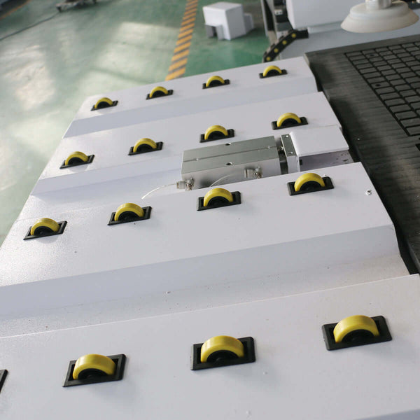 Auto-loading ATC CNC router with yellow wheels for efficient furniture production. Ideal for high-speed cabinet making.