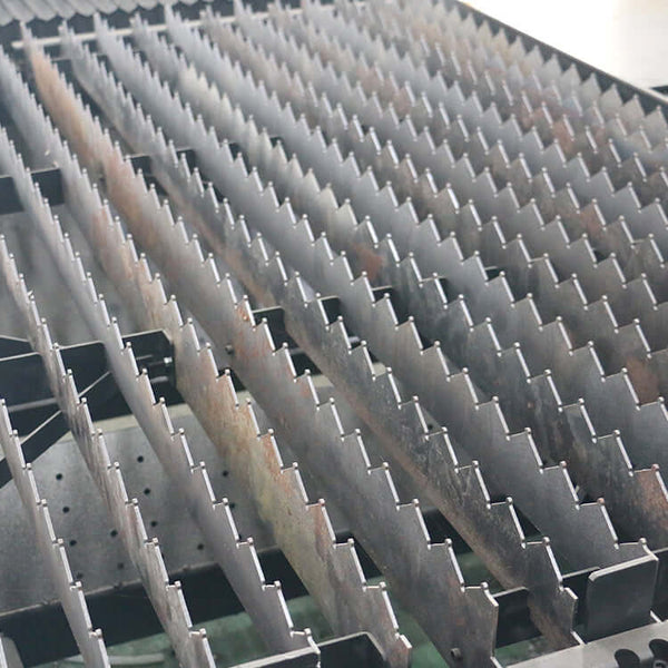 Close-up of high-precision fiber laser cutting machine bed for metal sheets and pipes