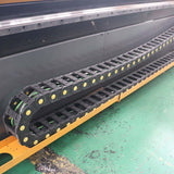 CNC router cable chain for high-efficiency double-process woodworking machine.