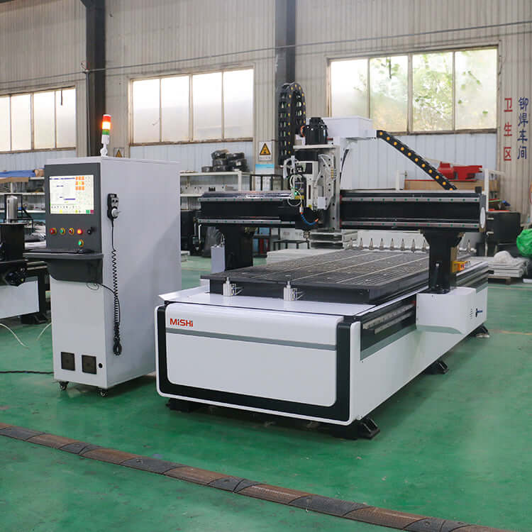 High-performance ATC CNC router for furniture, cabinet, and door making in workshop, ideal for cutting and engraving wood and composites.