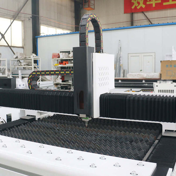 2 in 1 high-precision fiber laser cutting machine for metal sheets and pipes in a workshop setting.