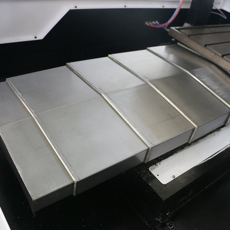 Close-up of Mini ATC CNC Router with disc tool changer and cast iron lathe bed showcasing high-precision crafting.