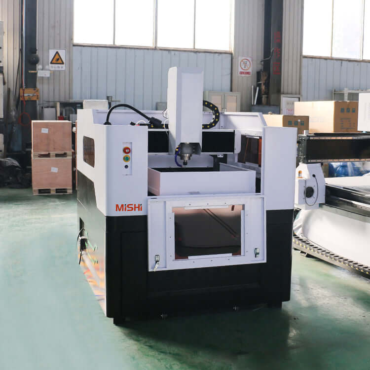 High-Precision Mini CNC Router for Metal Milling with water cooling spindle in an industrial setting