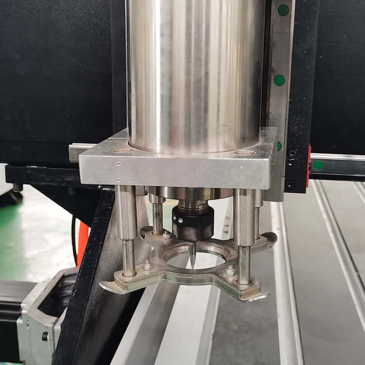 Close-up of industrial platen press component with metallic finish in a factory setting