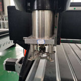 Industrial platen press machine in a factory setting, showcasing the metal components and mechanical parts.