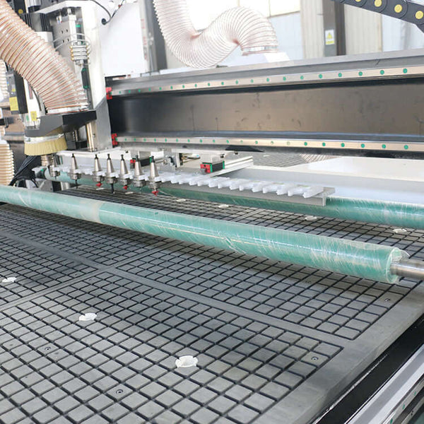 Machinery with pressure roller in industrial setting, featuring conveyor and control panel