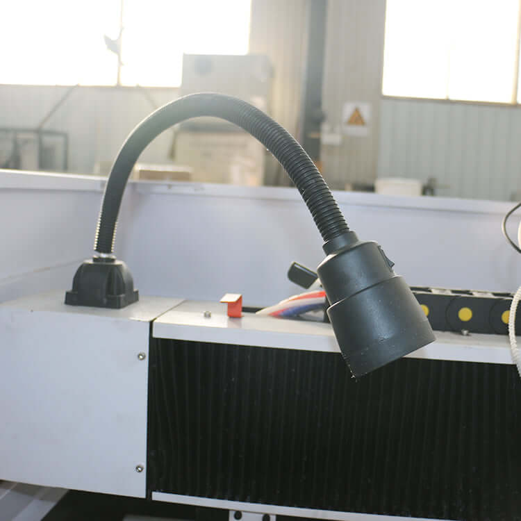 Close-up of water cooling spindle on mini CNC router for precision metal milling in factory setting