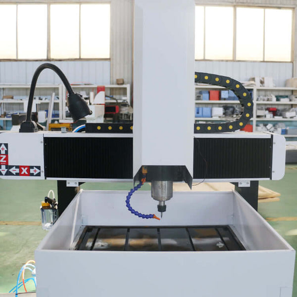 Mini metal CNC router for precise milling and engraving of aluminum and copper in industrial workshop setting.