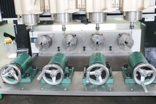 Precision multi-head 4-axis CNC router for 3D woodwork and mass production, featuring welded steel for durability and simultaneous operation.