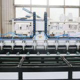 Multi-head 4-axis CNC router machine for precise 3D wood carving and mass production displayed in an industrial workshop.