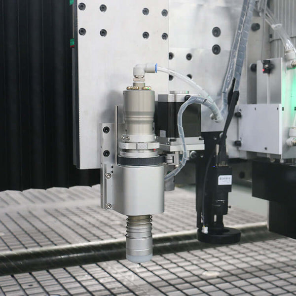 Close-up view of a multifunction ATC CNC router with oscillating knife and CCD camera, showcasing precision engineering for diverse materials.