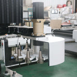 Close-up of a Multifunction ATC CNC Router with oscillating knife and CCD camera used for cutting and engraving in furniture manufacturing.