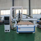 Multifunction ATC CNC Router with oscillating knife and CCD camera in an industrial setting for cutting and engraving various materials.