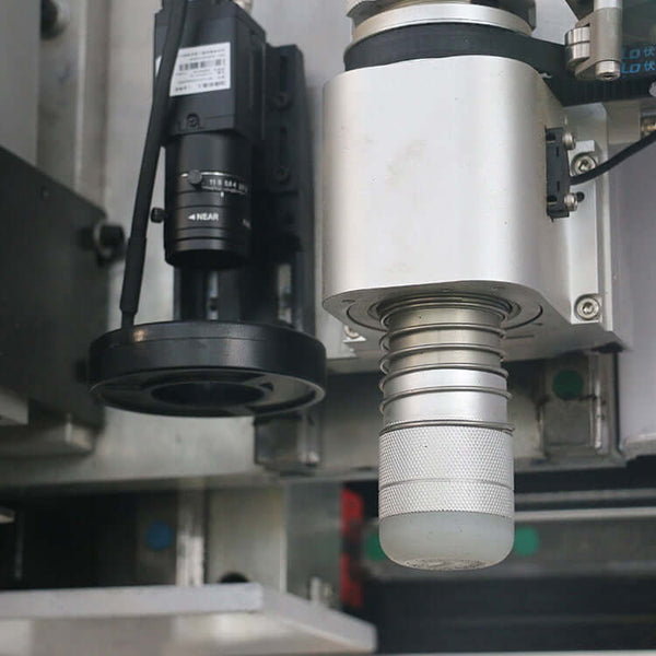 Close-up of Multifunction ATC CNC Router with oscillating knife and CCD camera for precision cutting and engraving in industrial applications.