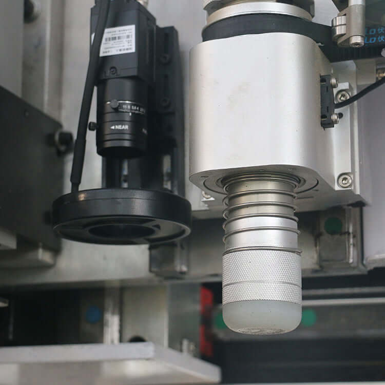 Close-up of Multifunction ATC CNC Router with oscillating knife and CCD camera for precision cutting and engraving in industrial applications.