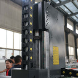 Close-up of New Design ATC CNC Router featuring CCD camera and pressure roller used for cutting and engraving in the furniture industry.