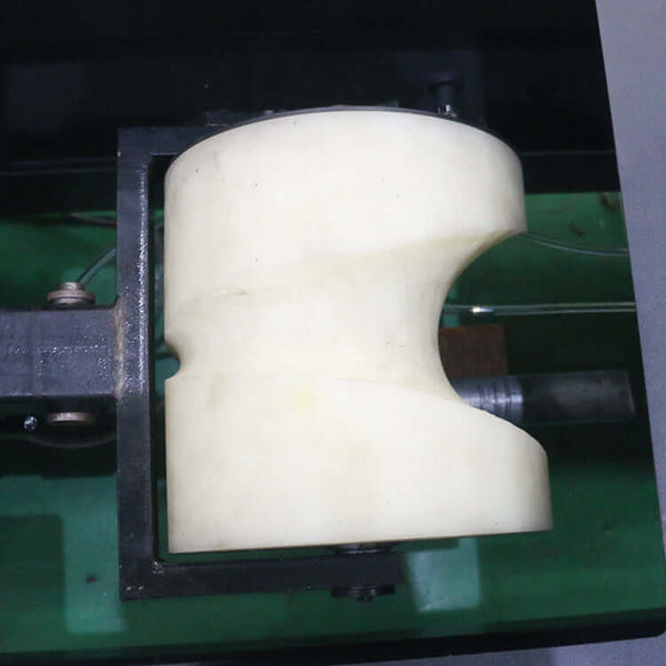 High-precision fiber laser cutting machine component for pipe and sheet cutting displayed up close.