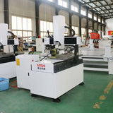 4 Axis Mini CNC Router with Rotary Axis for 2D and 3D carving, used for milling metals like steel and aluminum in a workshop setting.