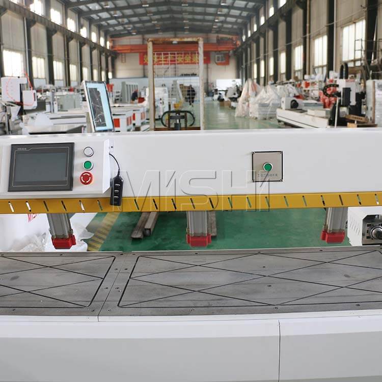 Precision CNC side hole drilling machine for furniture production in a factory setting, featuring advanced screen controls.