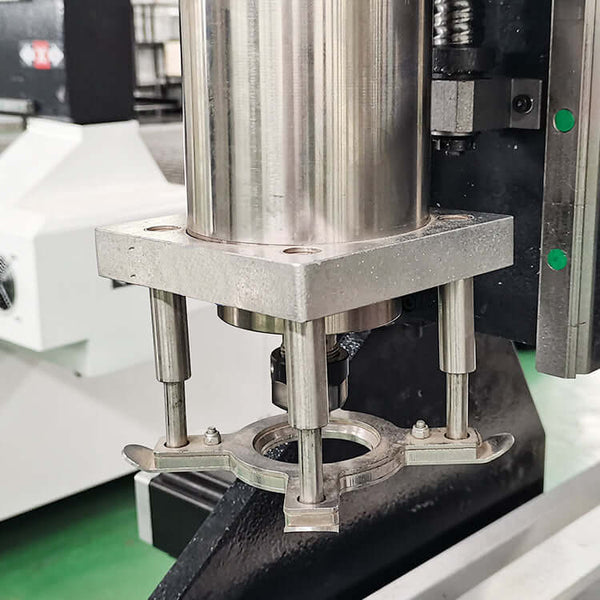 Close-up of a platen press component in a workshop setting, featuring metal parts and machinery elements.