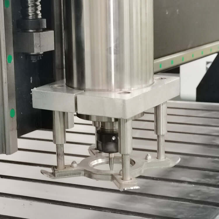 Industrial platen press machine showcasing metal components on a precision table in a manufacturing setting.