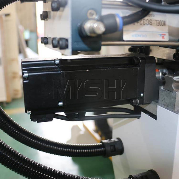 Close-up of precision CNC side hole drilling machine motor for furniture production with imported components for stability.